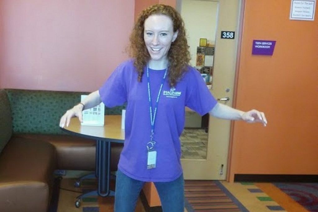 Librarian balancing on an unseen object