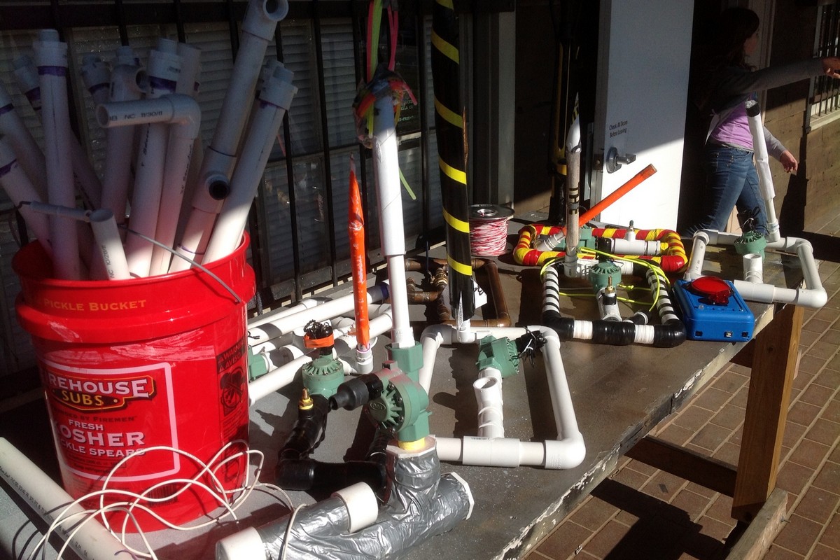 5 or more compressed air rockets launchers on a table