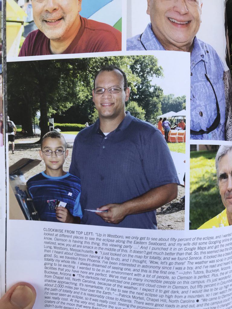 Photo of a page from a book - Eclipse Over Clemson - With a father and son