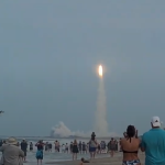 Starliner rocket 10 seconds after liftoff as seen from a beach 5 miles away
